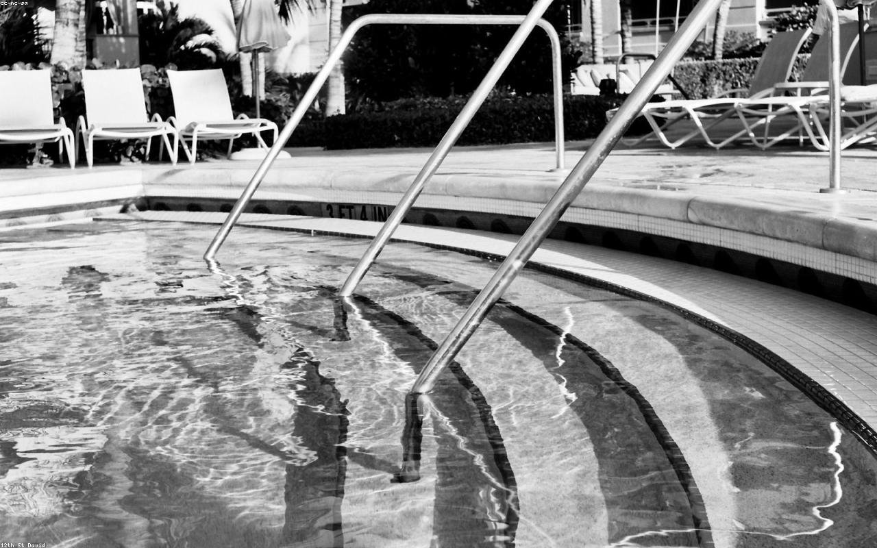 Pool steps and water clarity with palms in background